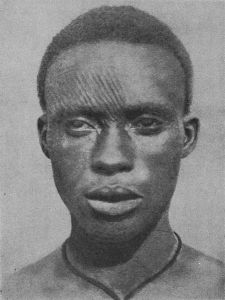 Igbo man with facial scarifications ("ichi"), early 20th century